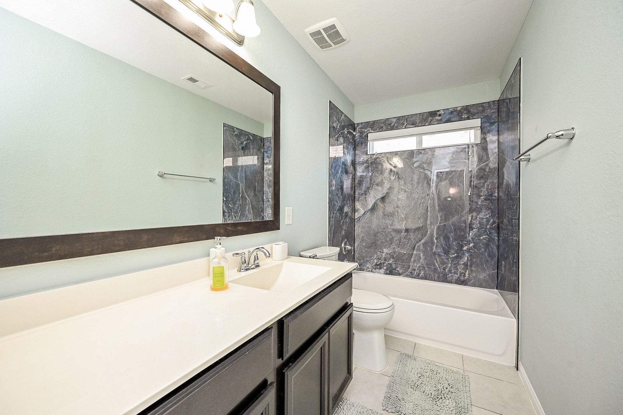 7042 Sliding Rock Circle Spring, TX 77379 - Photo 34 of 44 Chic and modern third bathroom, freshly updated for style and comfort.