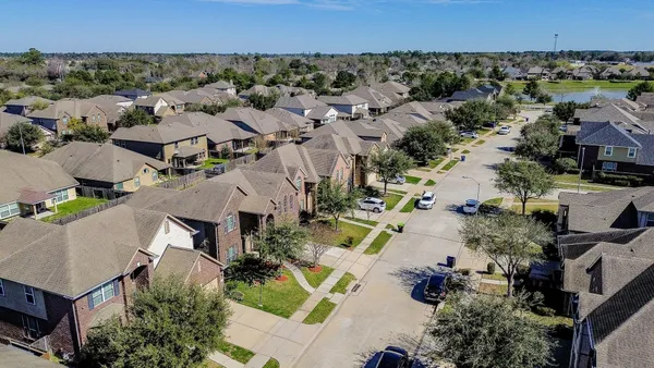 an aerial view of a city with lots of residential buildings