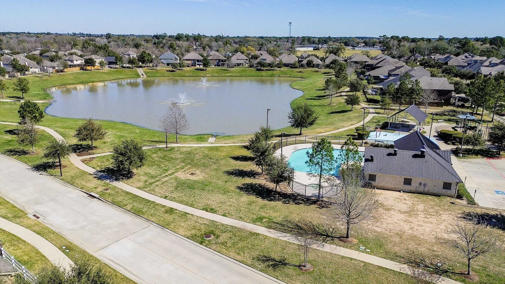 7042 Sliding Rock Circle Spring, TX 77379 - Photo 43 of 44 Combined view of pool,lake,playground and picnic area