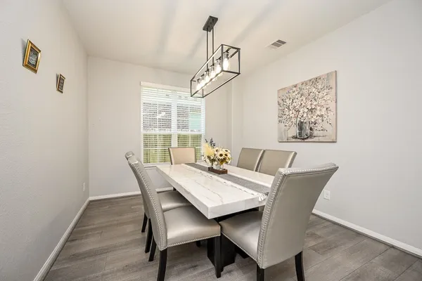 a view of a dining room with furniture