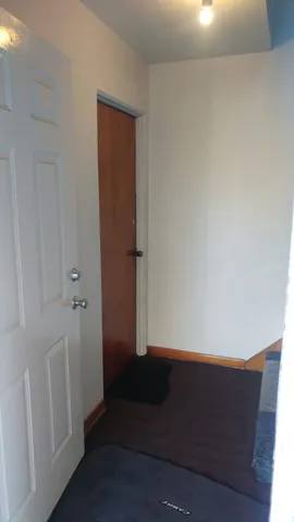 an empty room with wooden floor