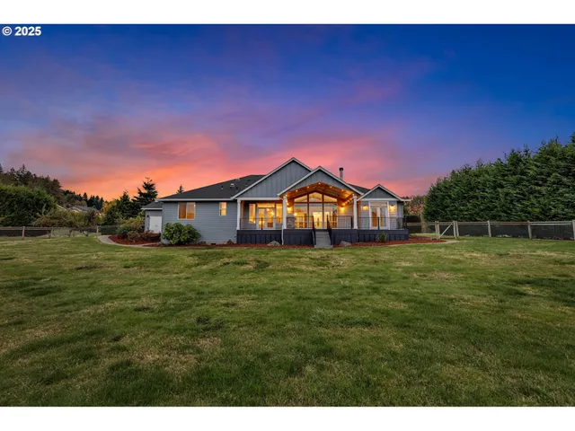 a view of a big house with a big yard