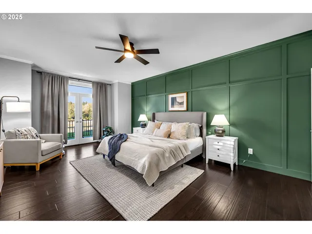 a bedroom with a bed and a wooden floor