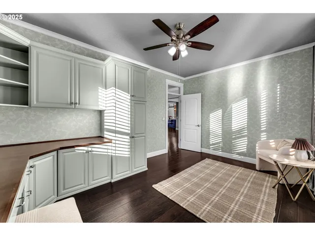 a open hall with cabinets and wooden floor