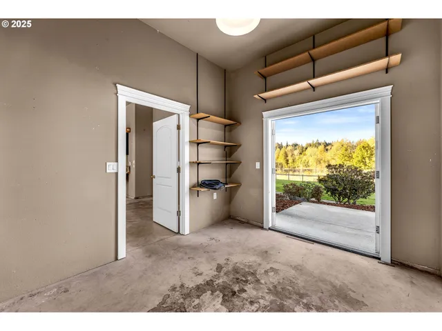 a view of empty room with a fireplace