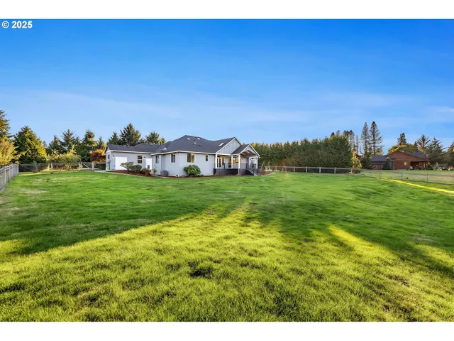 a view of a house with a big yard