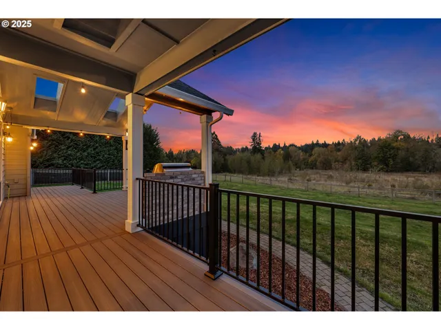 a view of balcony with wooden floor and outdoor space