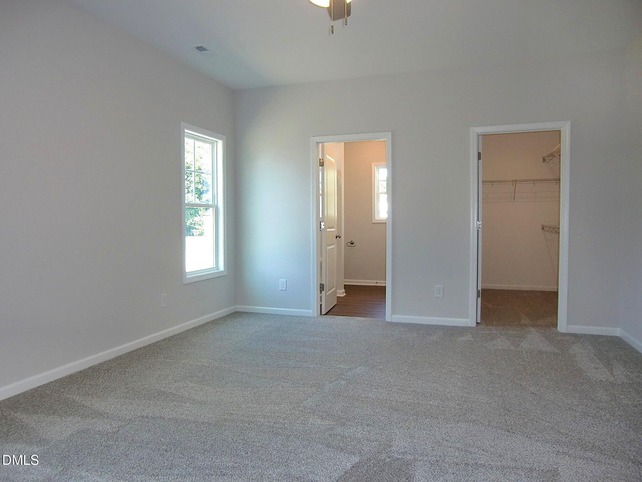 100 Covington Lane Dunn, NC 28334 - Photo 44 of 61 an empty room with windows and closet