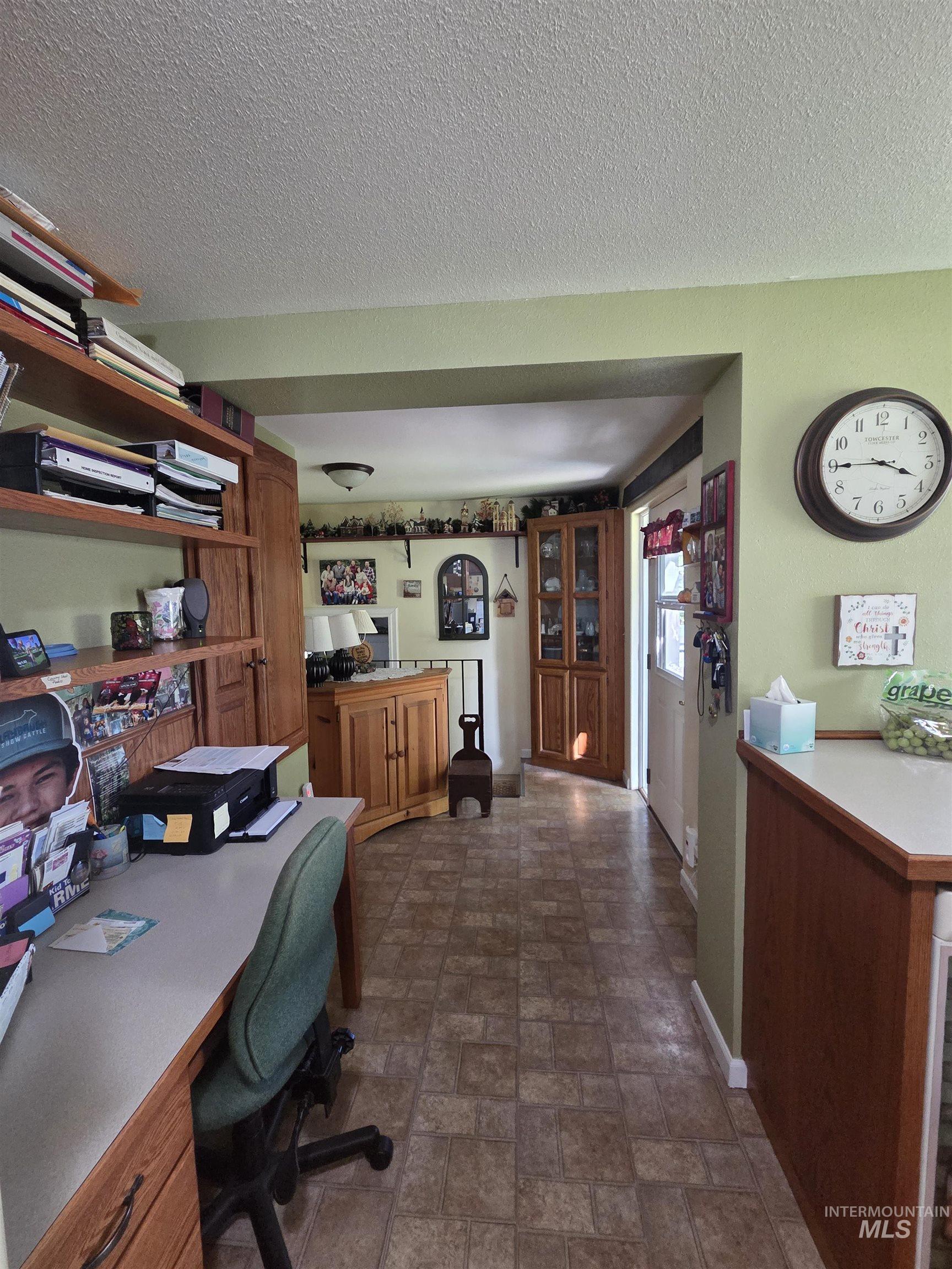109 South 3rd Street Pomeroy, WA 99347 - Photo 10 of 36 Kitchen/office area featuring wood-finish cabinetry, a white countertop, and tiled flooring