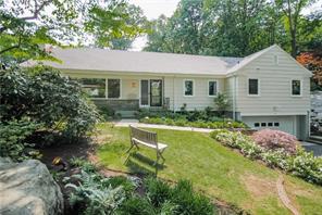 6 South Ridge Road Larchmont, NY 10538 - Photo 1 of 1 Entrance to the property with a peaceful view of the front lawn with beautiful beds filled with specimen trees andcarefully selected plantings.