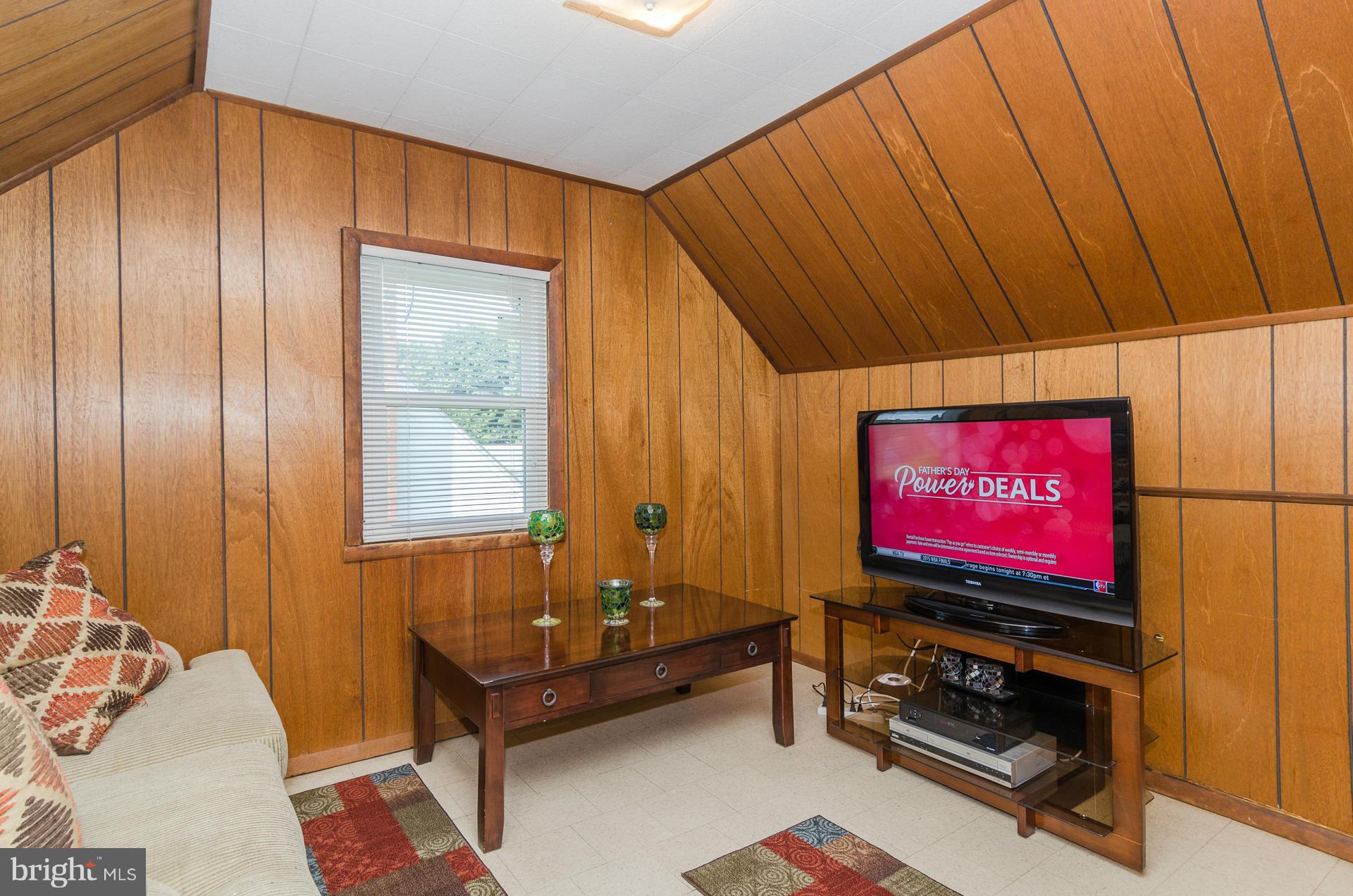 3522 Wild Cherry Road Baltimore, MD 21244 - Photo 16 of 30 a room with furniture and flat screen tv