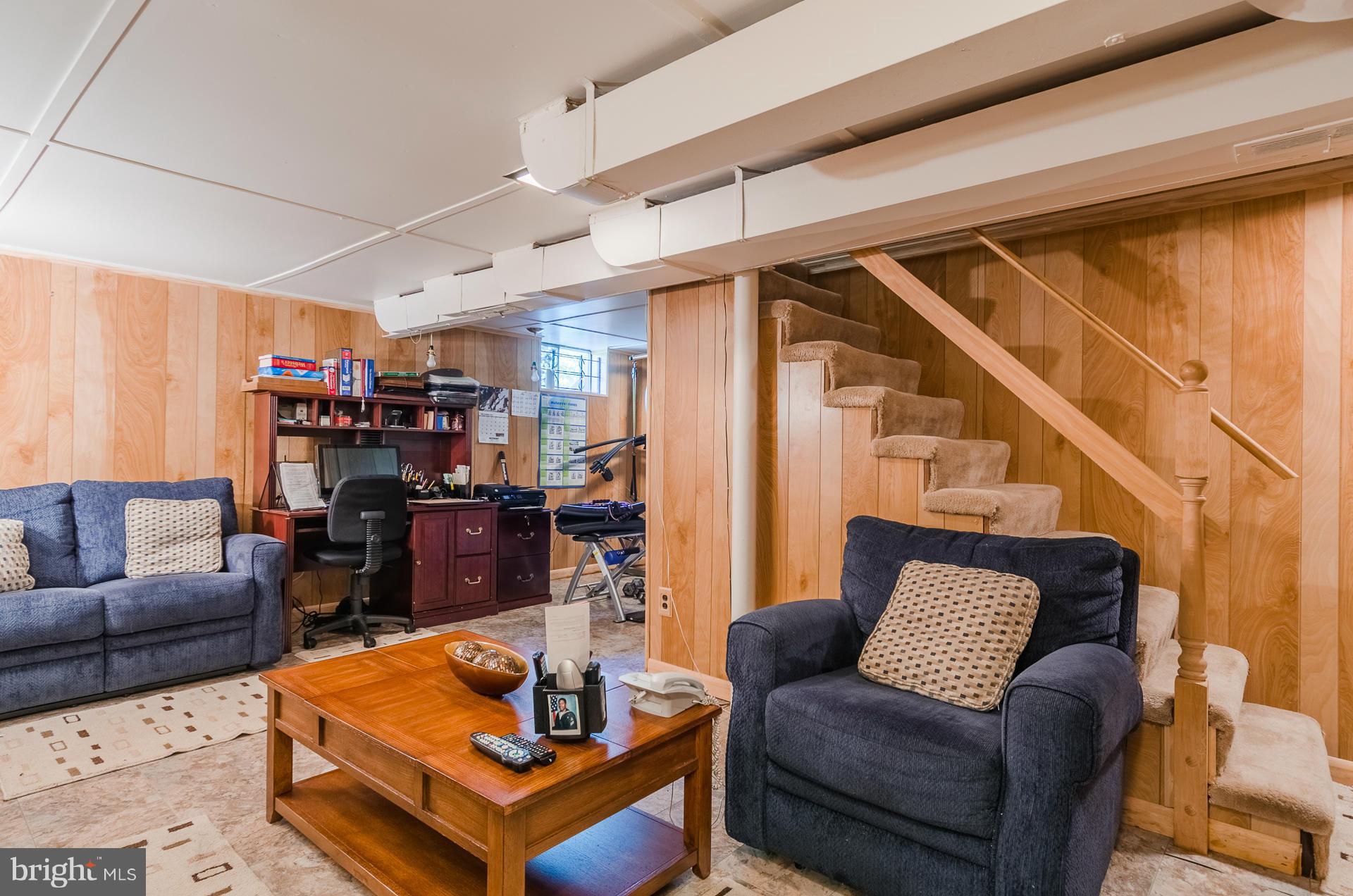 3522 Wild Cherry Road Baltimore, MD 21244 - Photo 22 of 30 a living room with furniture and a wooden floor