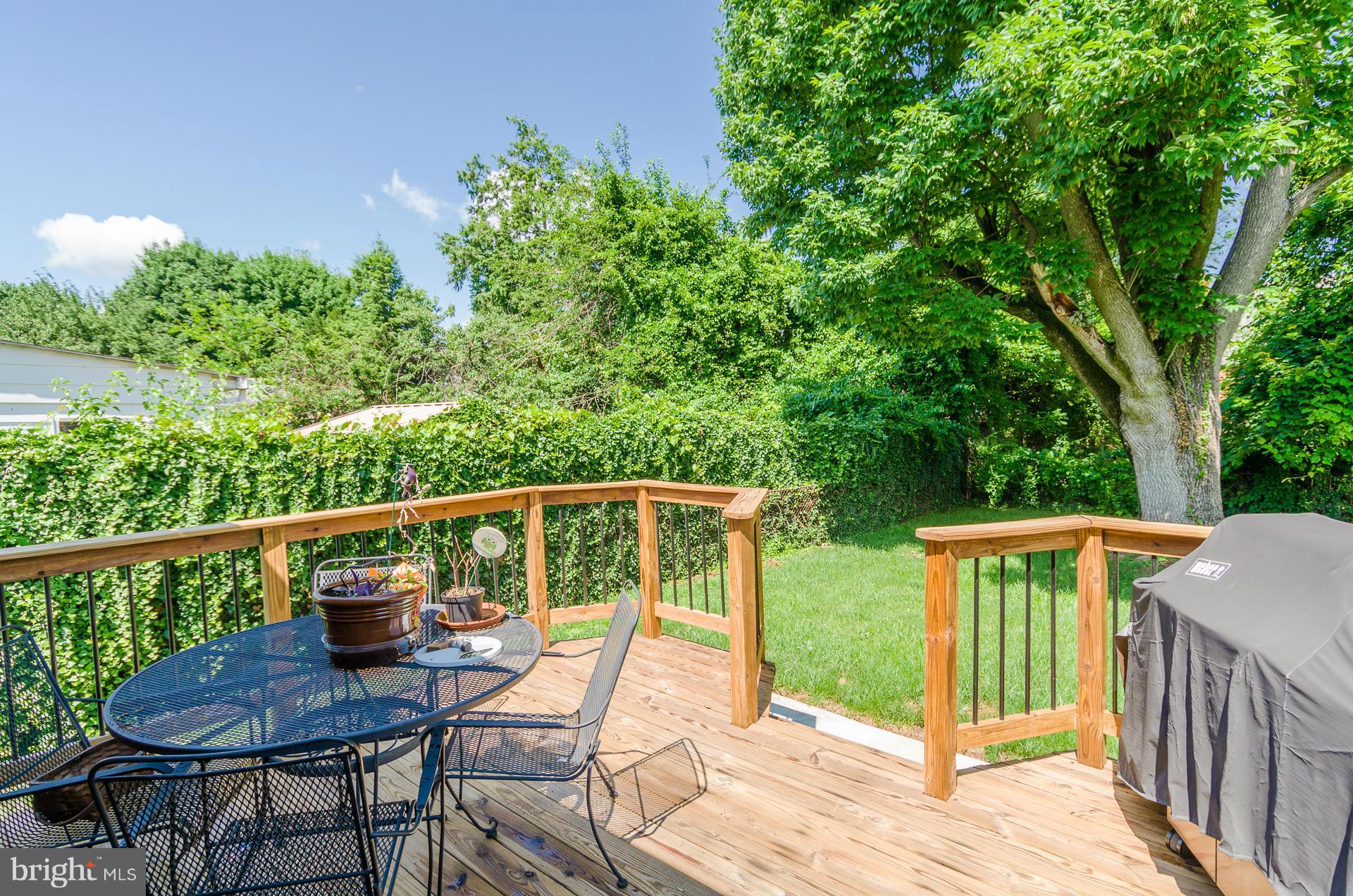 3522 Wild Cherry Road Baltimore, MD 21244 - Photo 26 of 30 a view of a deck with chairs and wooden fence