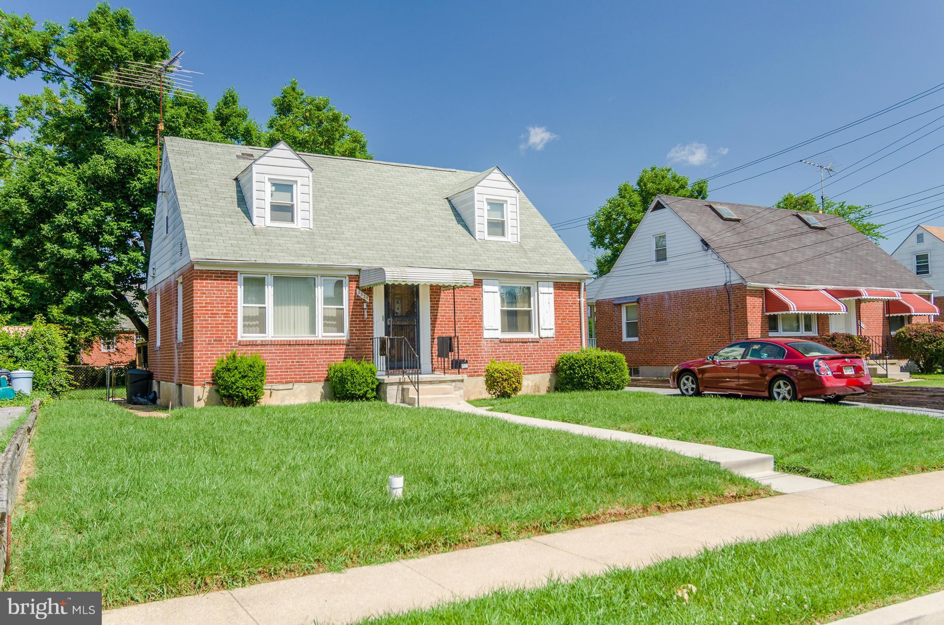 3522 Wild Cherry Road Baltimore, MD 21244 - Photo 30 of 30 front view of a house with a yard