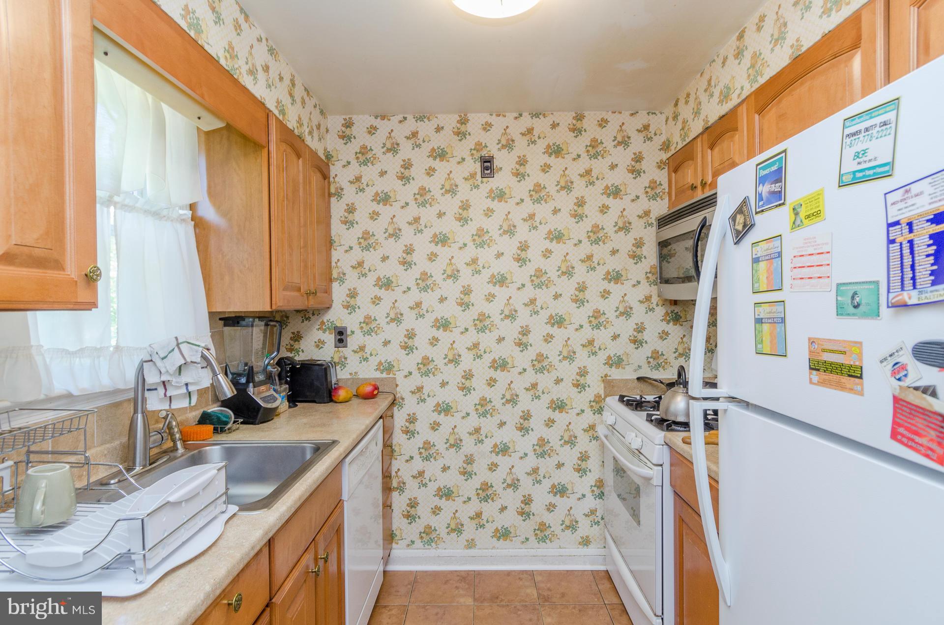 3522 Wild Cherry Road Baltimore, MD 21244 - Photo 5 of 30 a bathroom with a sink toilet and shower
