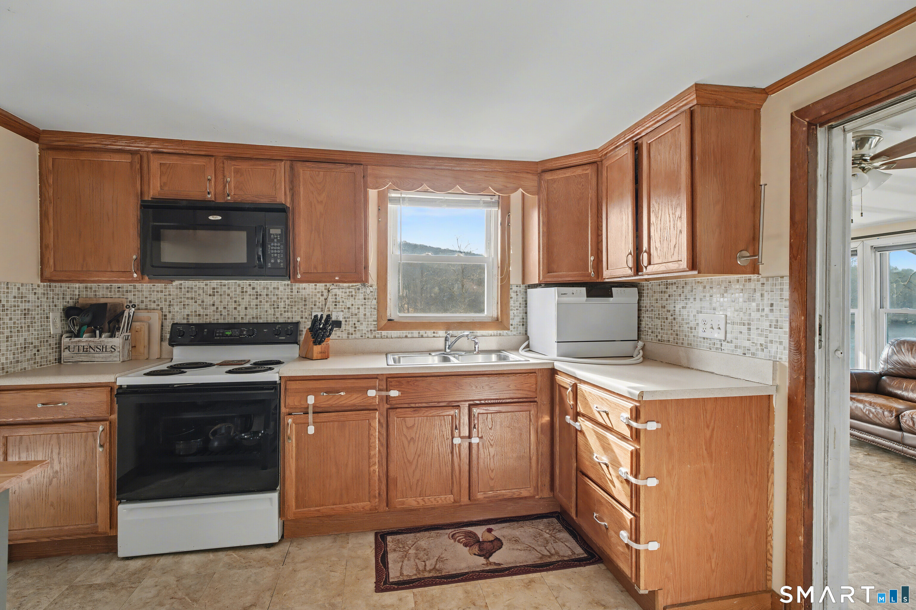 95 Kitemaug Road Montville, CT 06382 - Photo 13 of 24 a kitchen with a stove sink and microwave