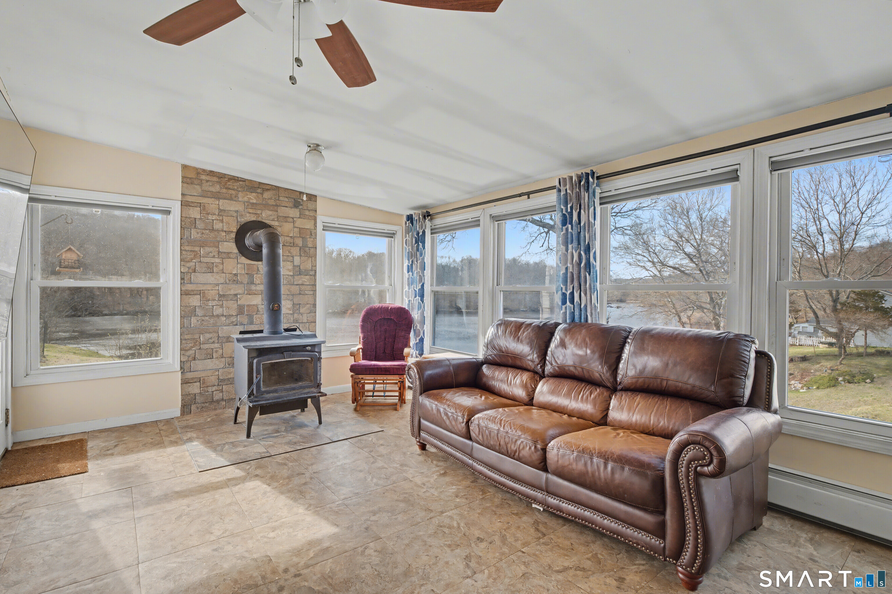 95 Kitemaug Road Montville, CT 06382 - Photo 16 of 24 a living room with furniture and a window