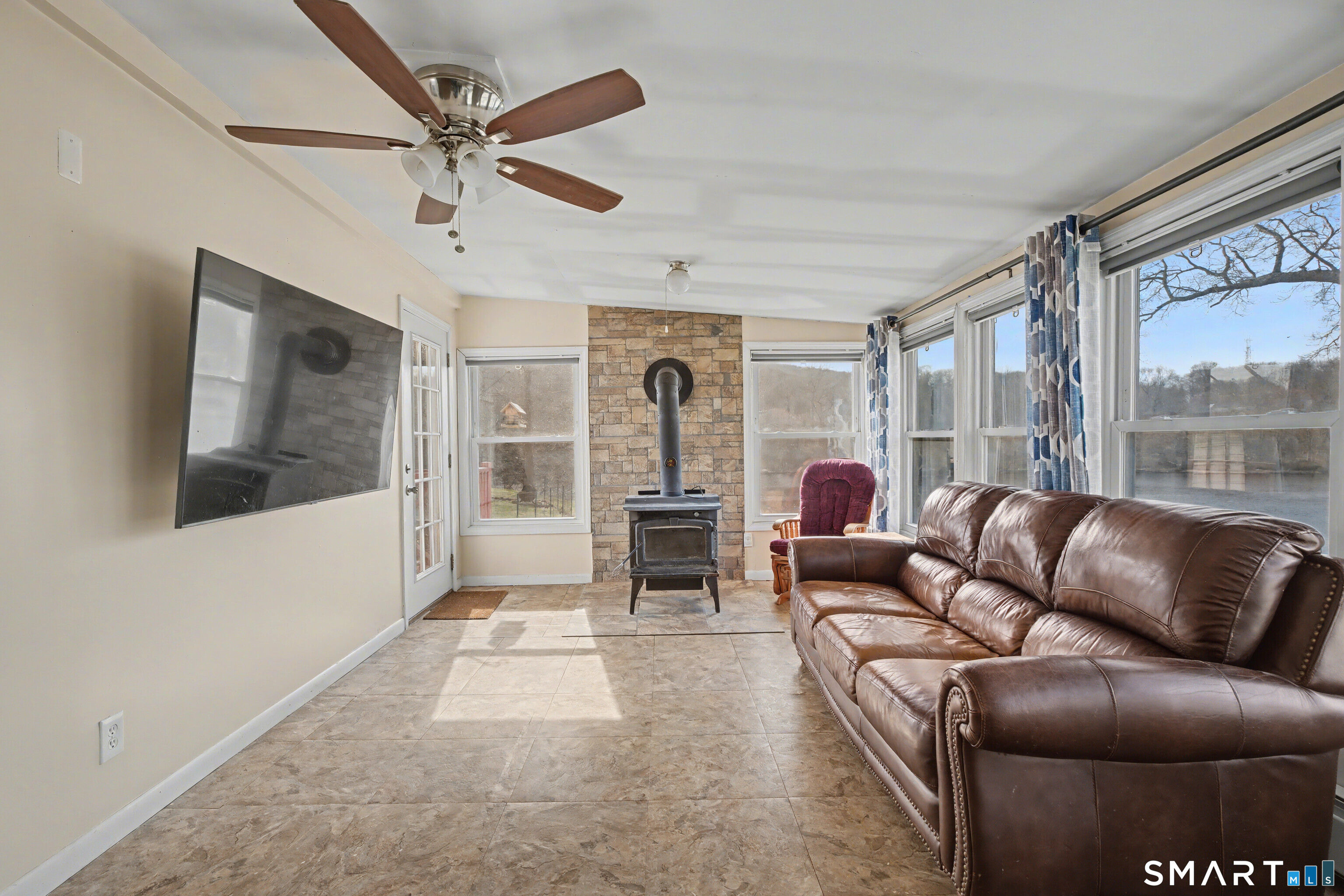 95 Kitemaug Road Montville, CT 06382 - Photo 17 of 24 a living room with furniture and a fireplace