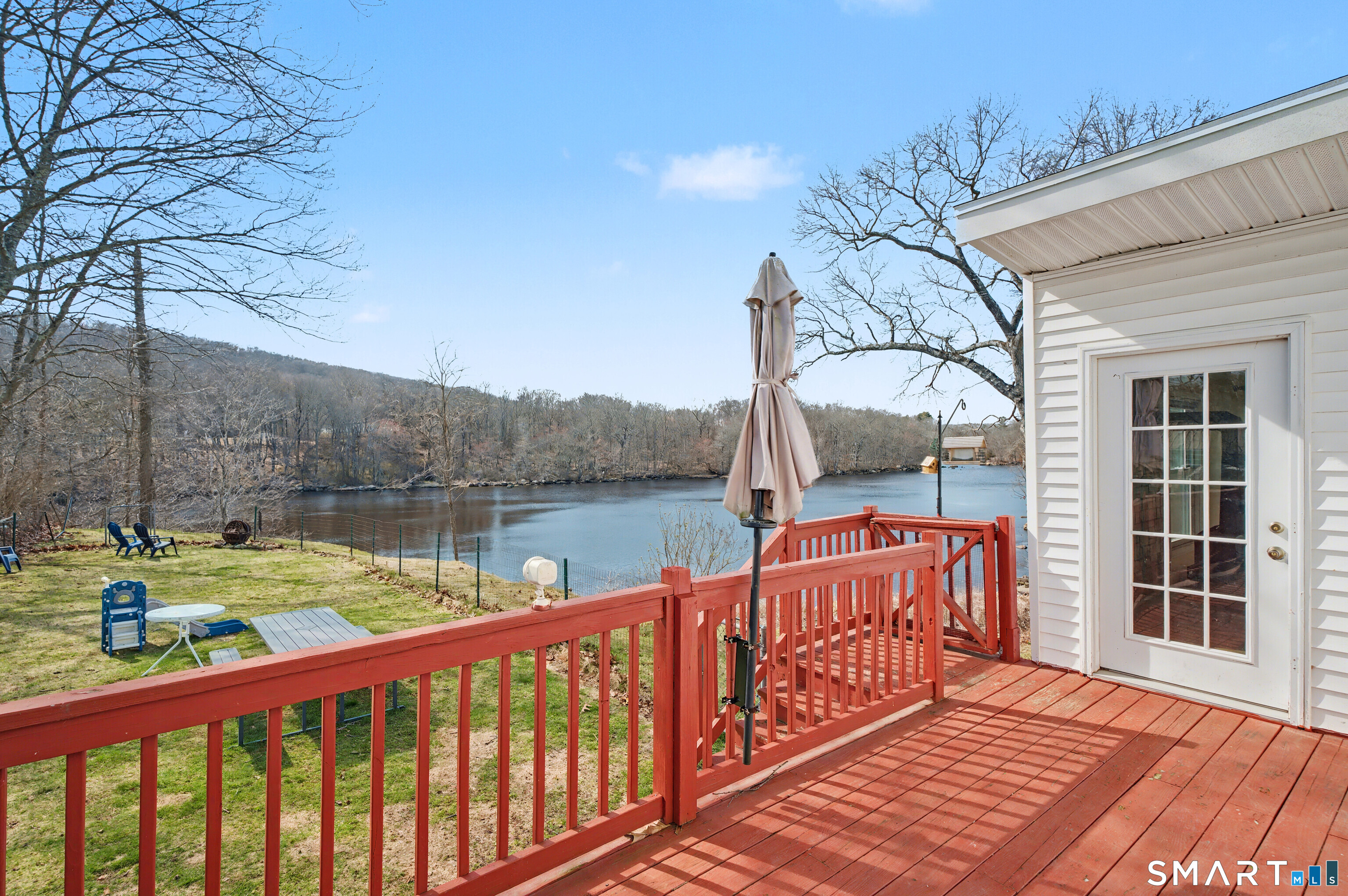 95 Kitemaug Road Montville, CT 06382 - Photo 19 of 24 a view of a wooden deck with a lake view