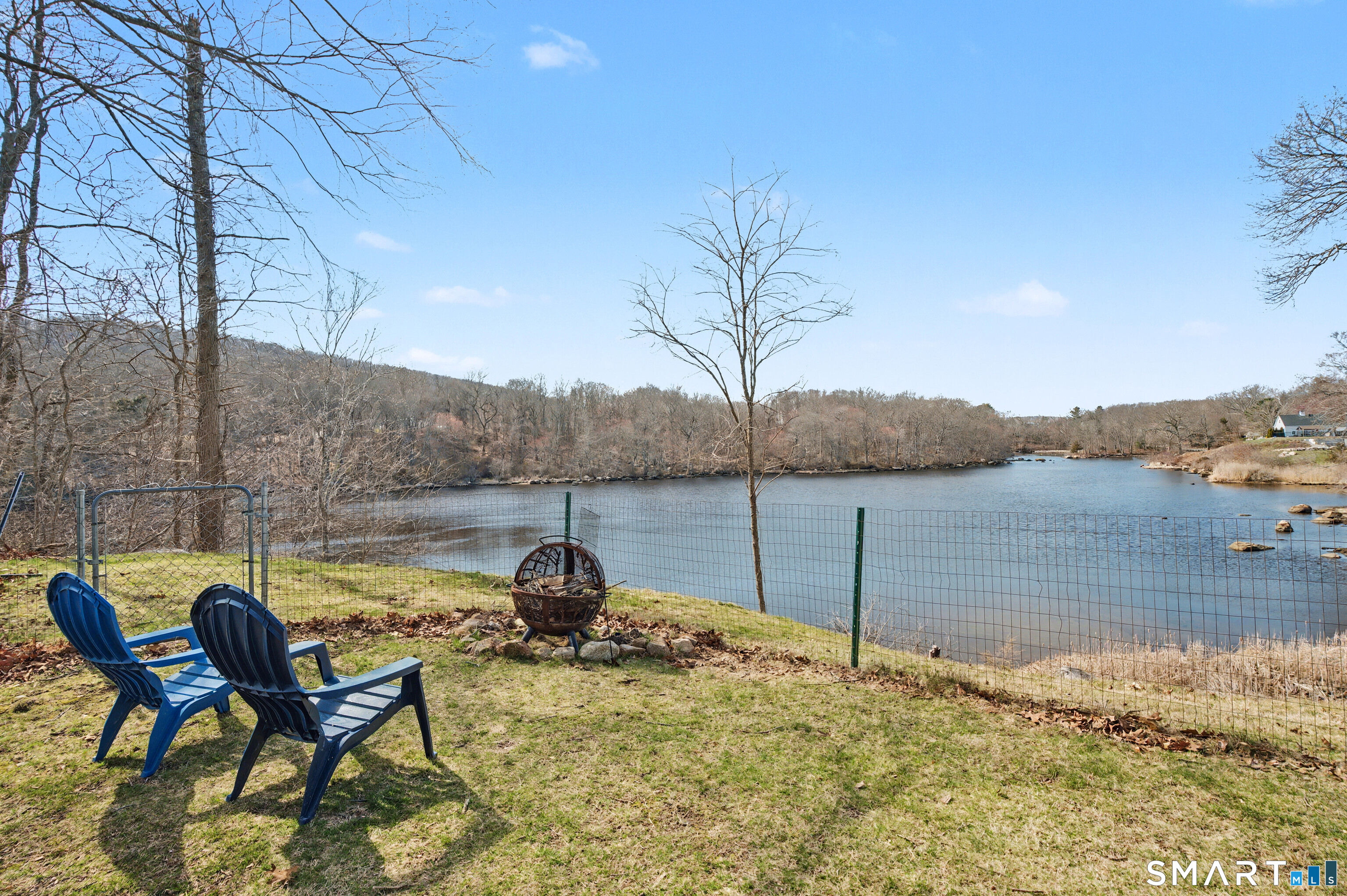 95 Kitemaug Road Montville, CT 06382 - Photo 20 of 24 a view of a lake with table and chairs