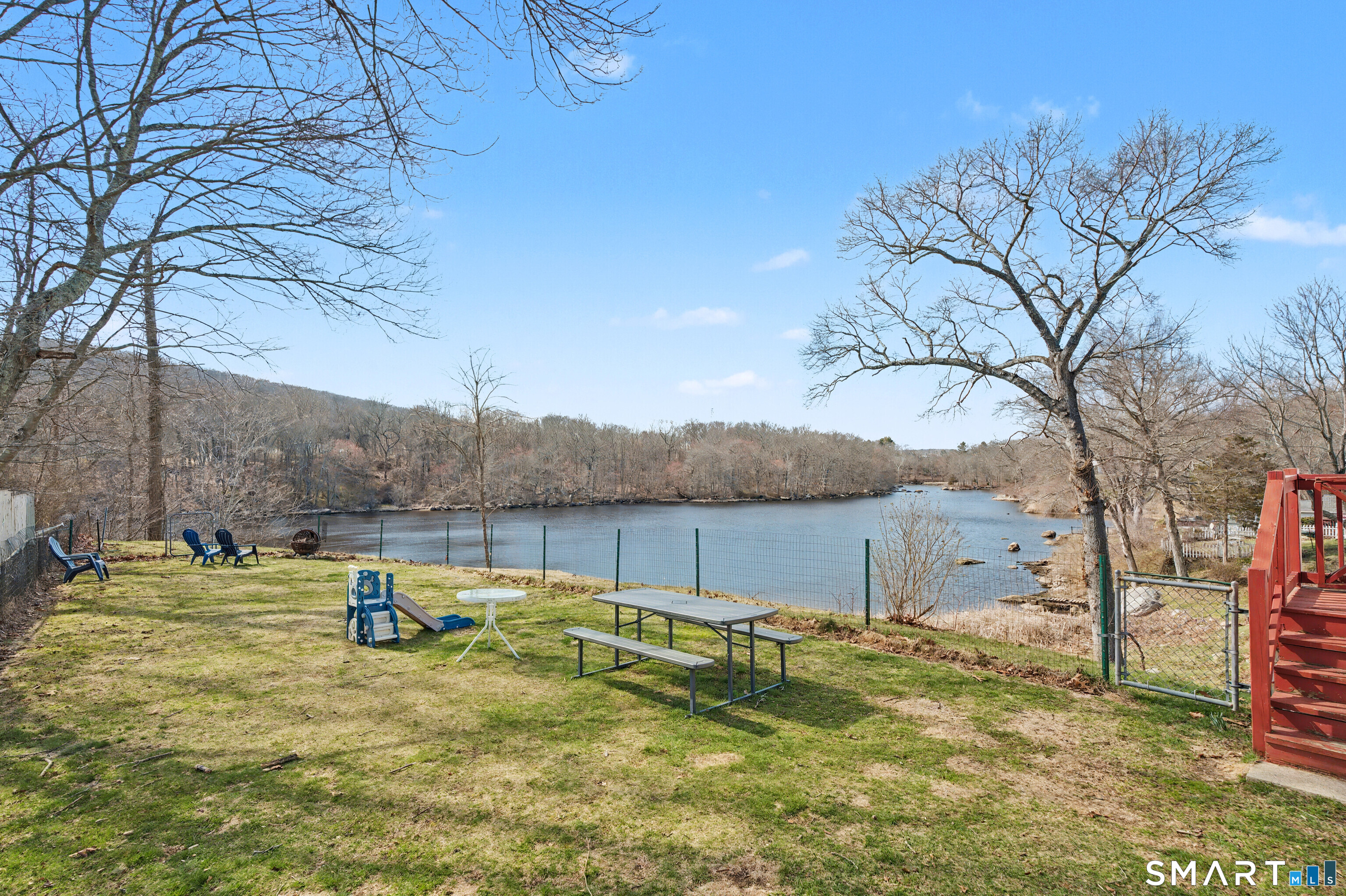 95 Kitemaug Road Montville, CT 06382 - Photo 21 of 24 a backyard of a house with table and chairs