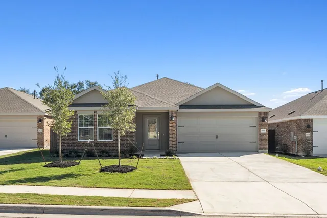 a house view with a garden space