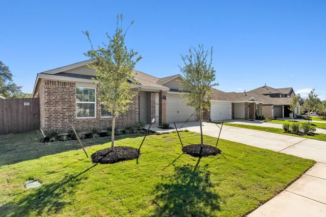 a house with swimming pool in front of it