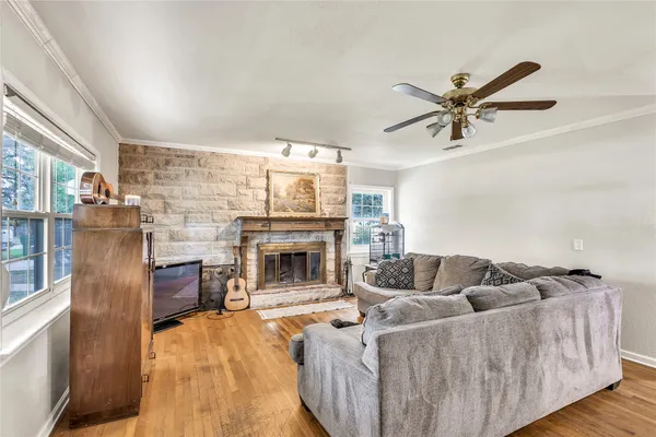 a living room with furniture and a fireplace