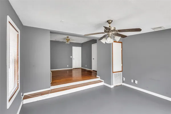 a view of room with ceiling fan