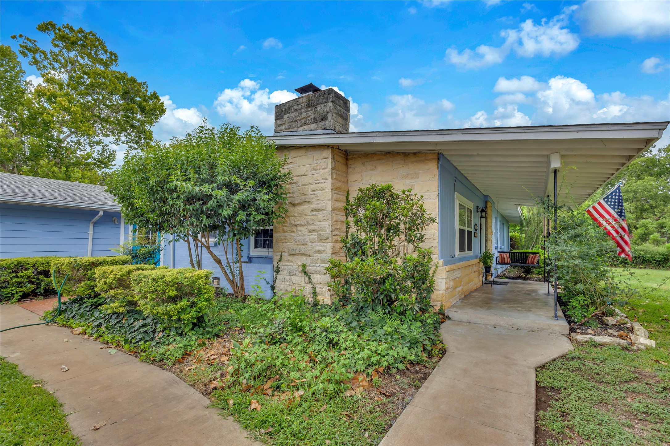 11909 Bluebonnet Lane Manchaca, TX 78652 - Photo 2 of 30 a front view of a house with plants