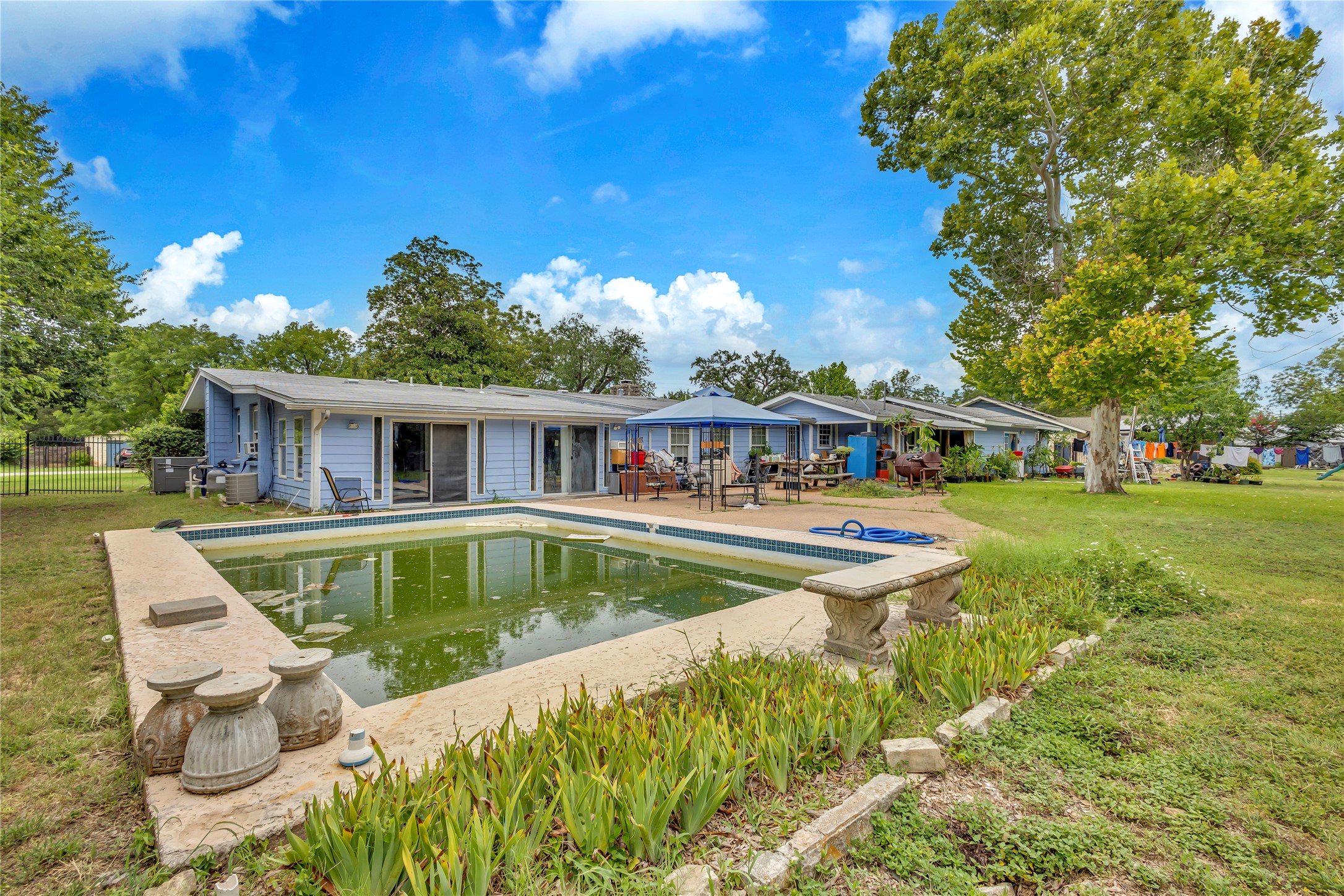 11909 Bluebonnet Lane Manchaca, TX 78652 - Photo 24 of 30 a view of house with swimming pool outdoor seating
