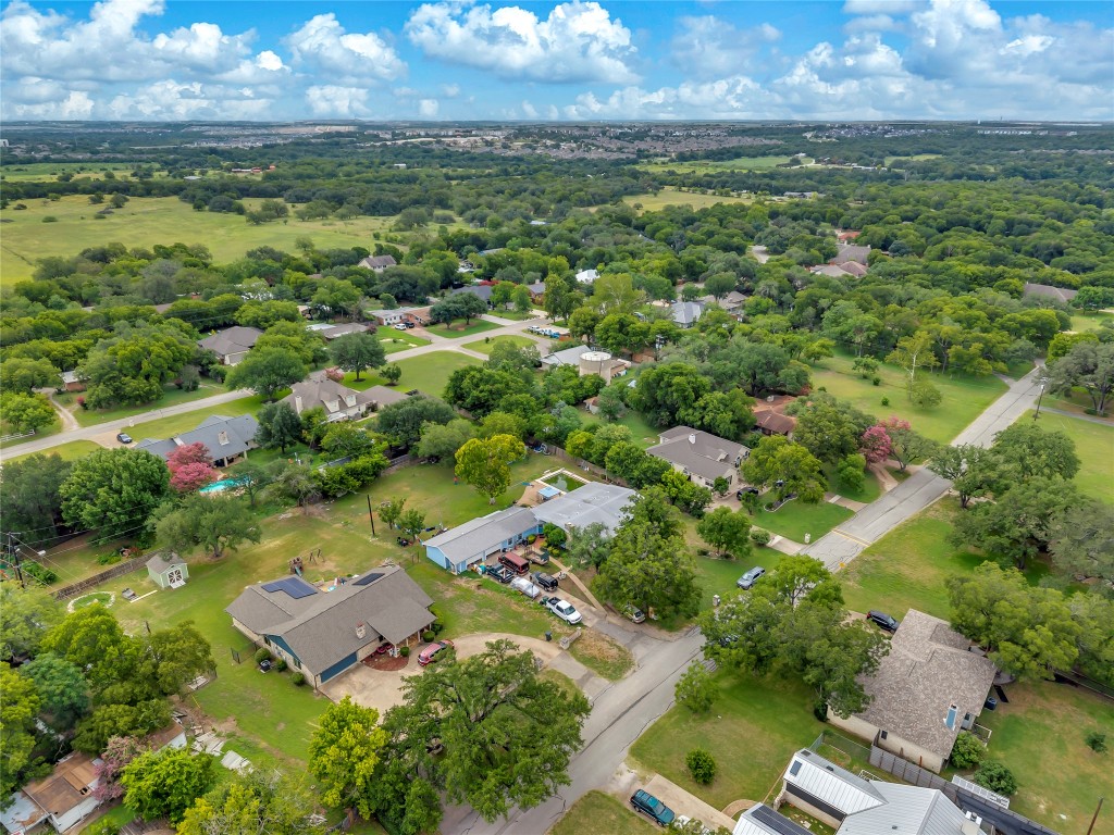 11909 Bluebonnet Lane Manchaca, TX 78652 - Photo 3 of 30 an aerial view of residential houses with outdoor space and trees