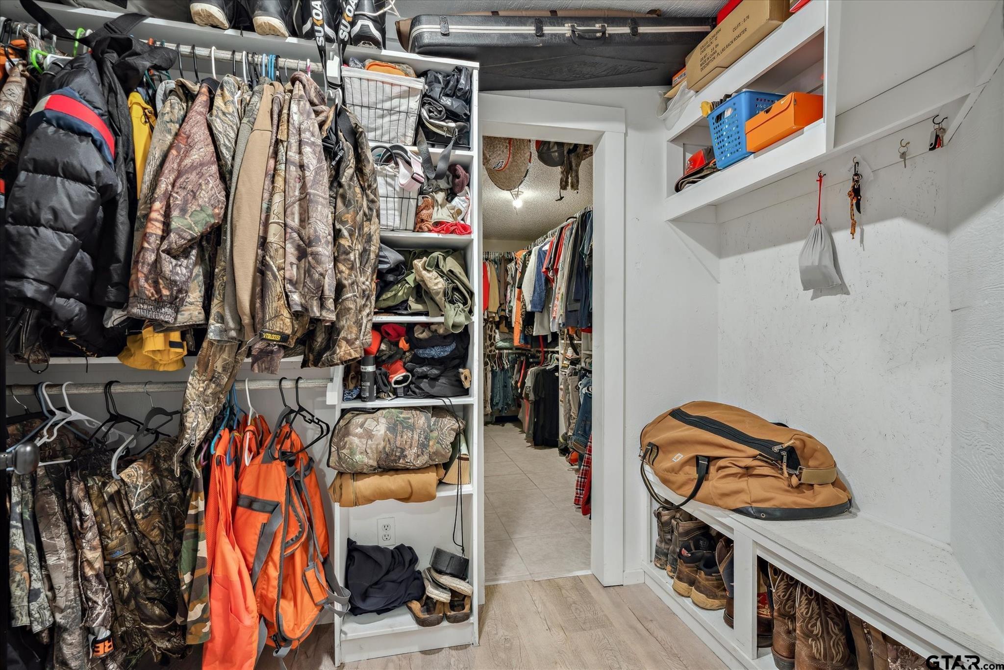 350 Alaska Street Van, TX 75790 - Photo 20 of 37 a view of walk in closet with clothes and shoes