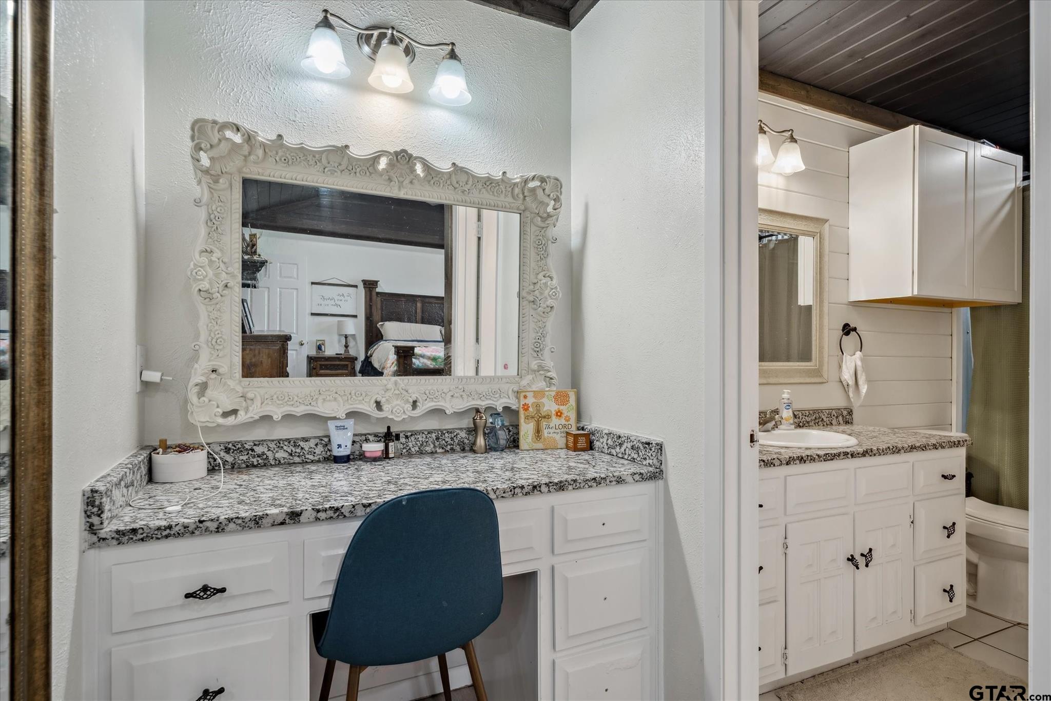 350 Alaska Street Van, TX 75790 - Photo 22 of 37 a bathroom with a granite countertop sink double vanity and a mirror