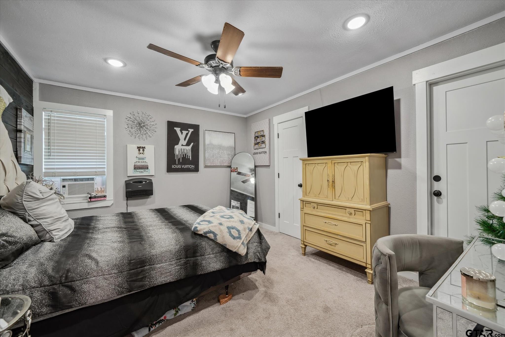 350 Alaska Street Van, TX 75790 - Photo 24 of 37 a bedroom with furniture and a flat screen tv