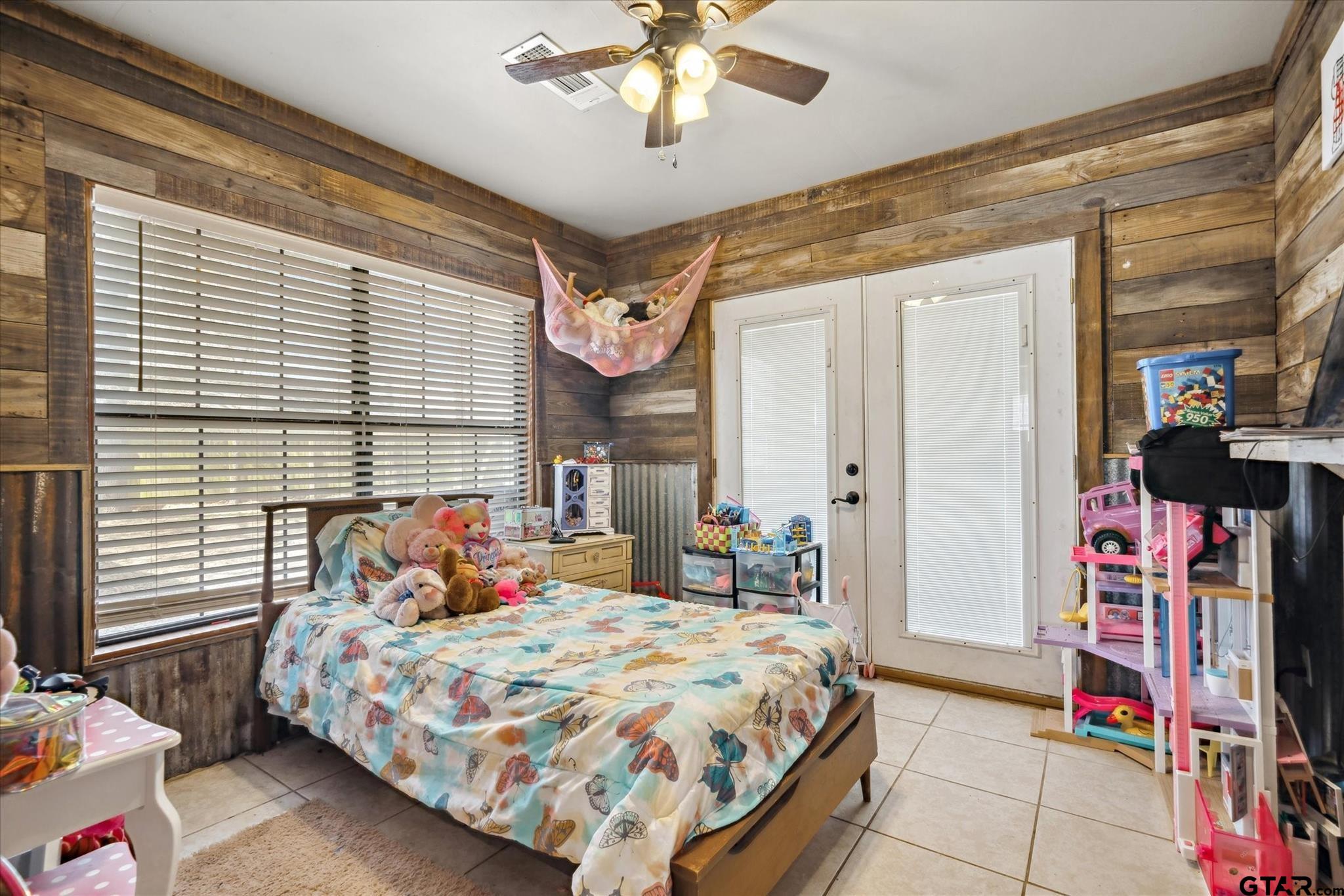 350 Alaska Street Van, TX 75790 - Photo 26 of 37 a bedroom with a bed a chandelier and dresser