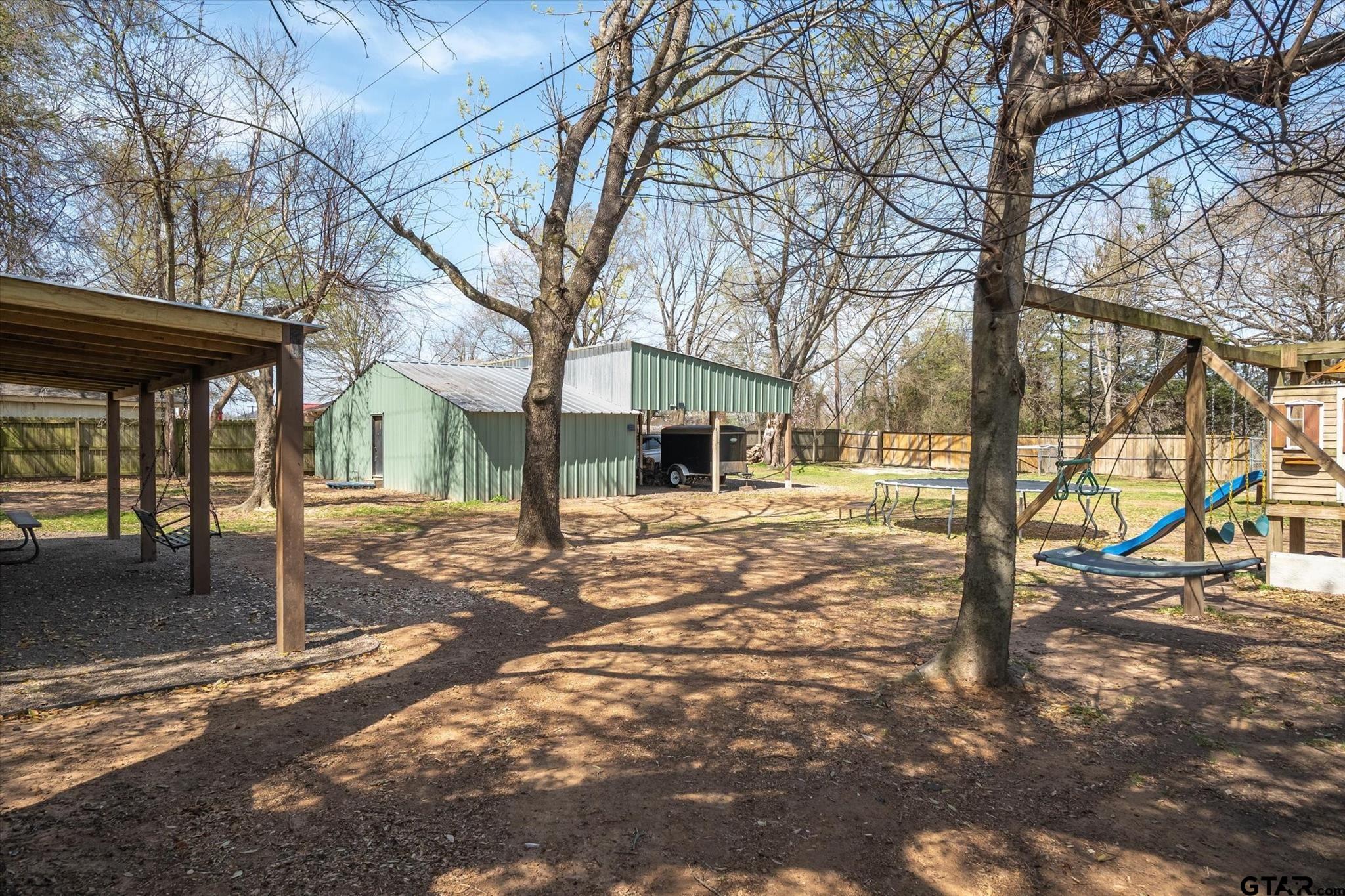 350 Alaska Street Van, TX 75790 - Photo 32 of 37 a house with trees in front of it