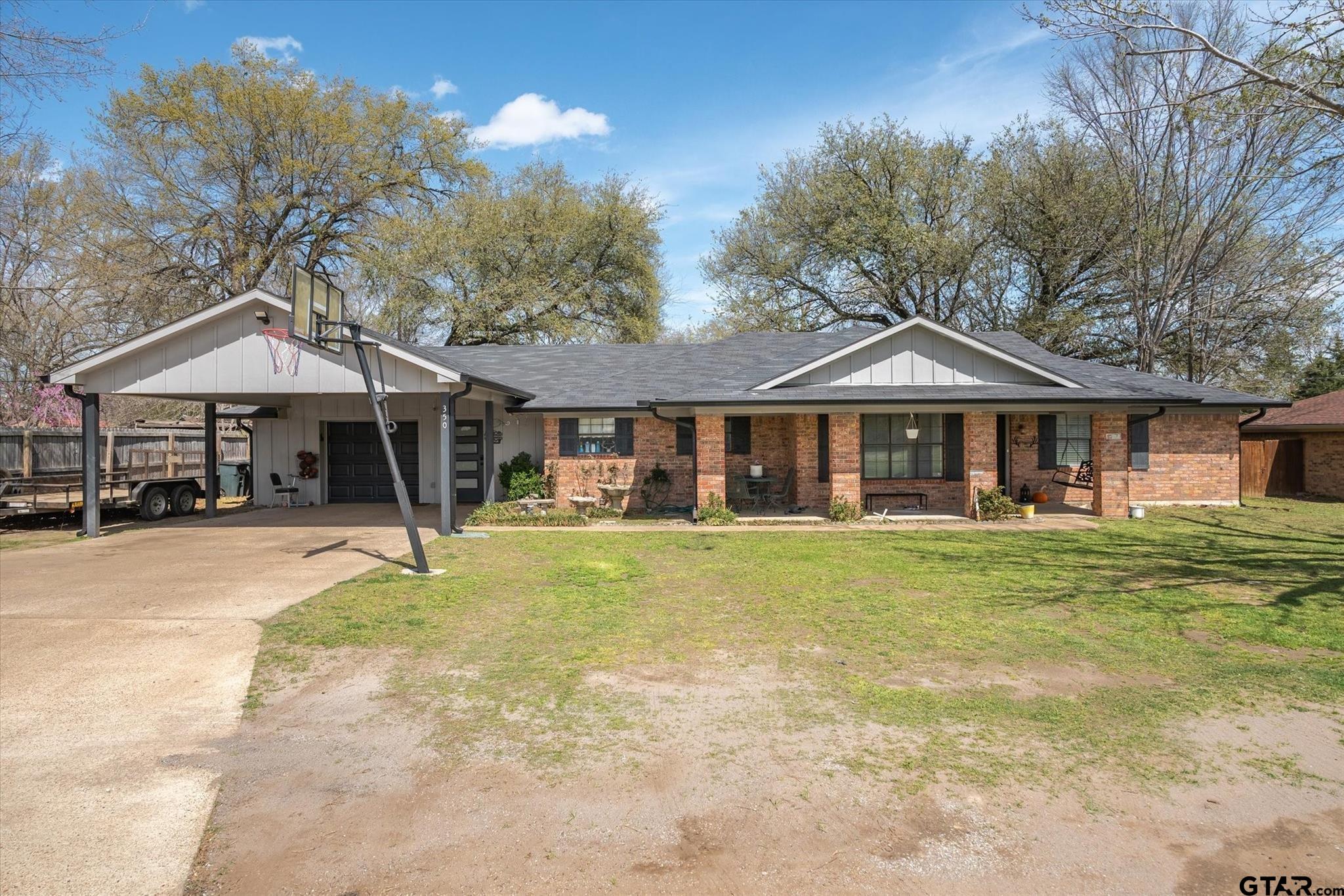 350 Alaska Street Van, TX 75790 - Photo 4 of 37 a front view of a house with a garden