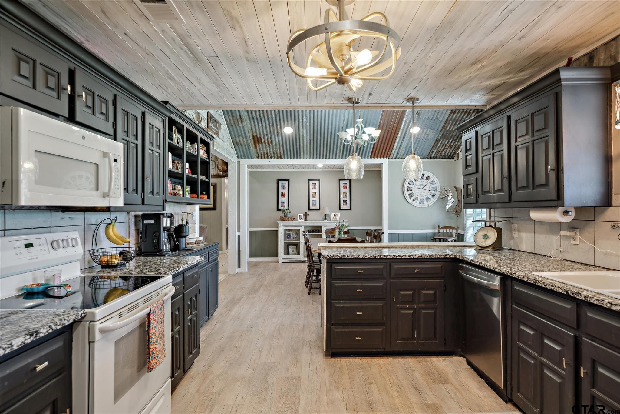 350 Alaska Street Van, TX 75790 - Photo 6 of 37 a kitchen with a sink and cabinets