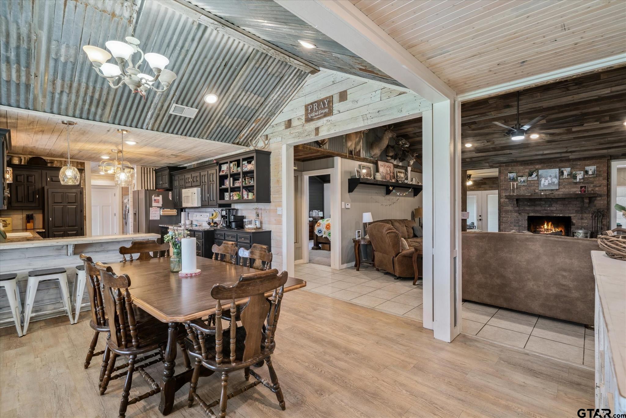 350 Alaska Street Van, TX 75790 - Photo 10 of 37 a dining room with furniture and a fireplace