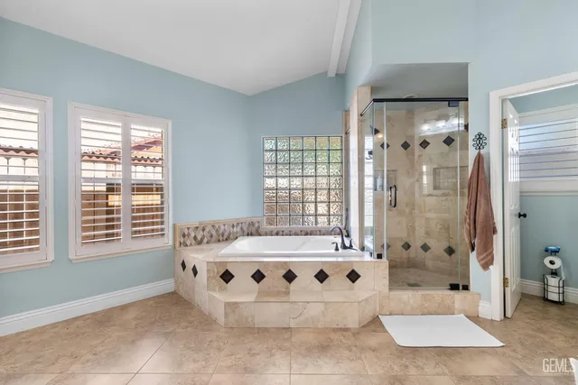 a bathroom with a bathtub and shower