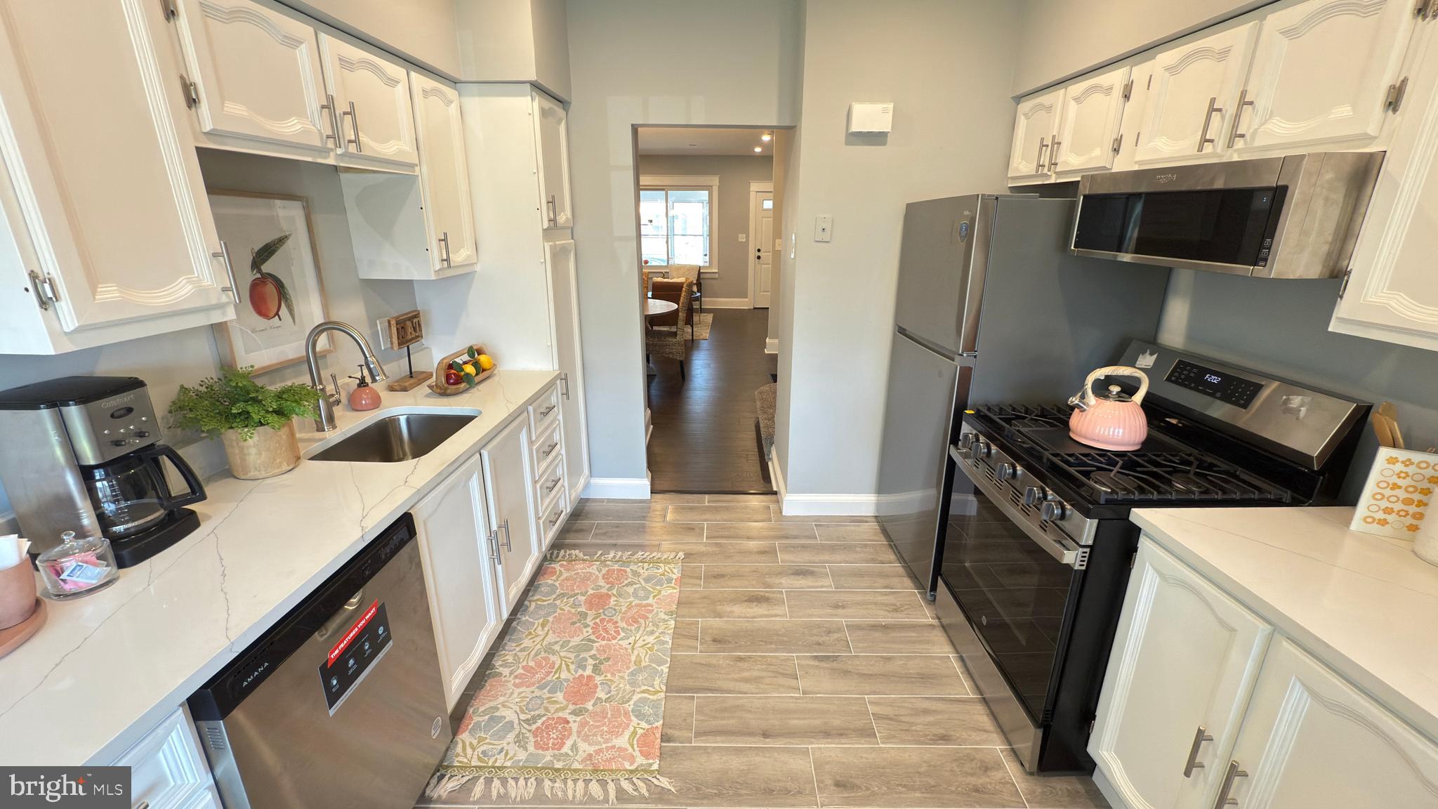 249 Hobart Avenue Hamilton, NJ 08629 - Photo 12 of 27 a kitchen with stainless steel appliances a refrigerator and a stove