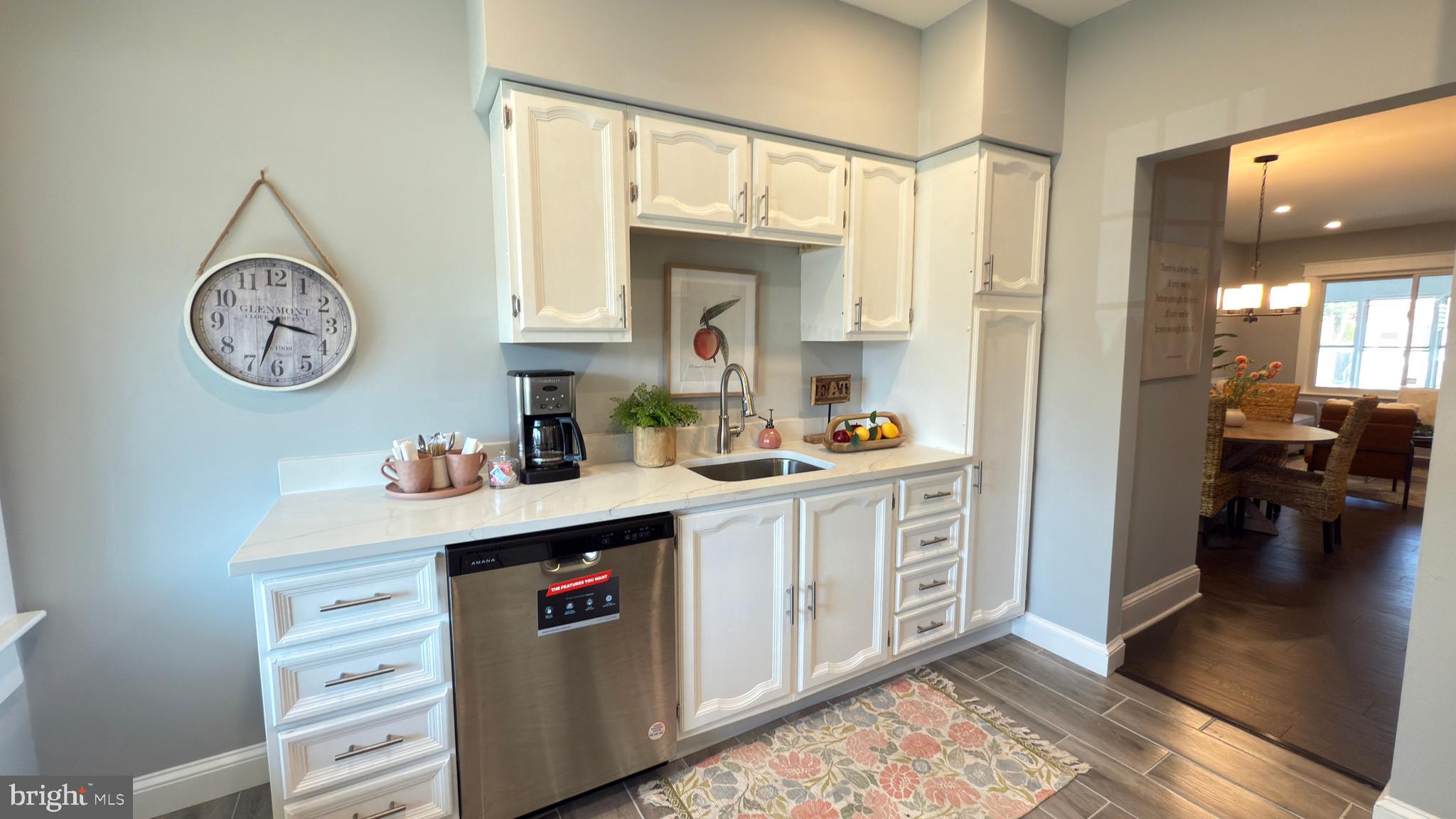 249 Hobart Avenue Hamilton, NJ 08629 - Photo 13 of 27 a kitchen with stainless steel appliances granite countertop a stove a sink and a refrigerator