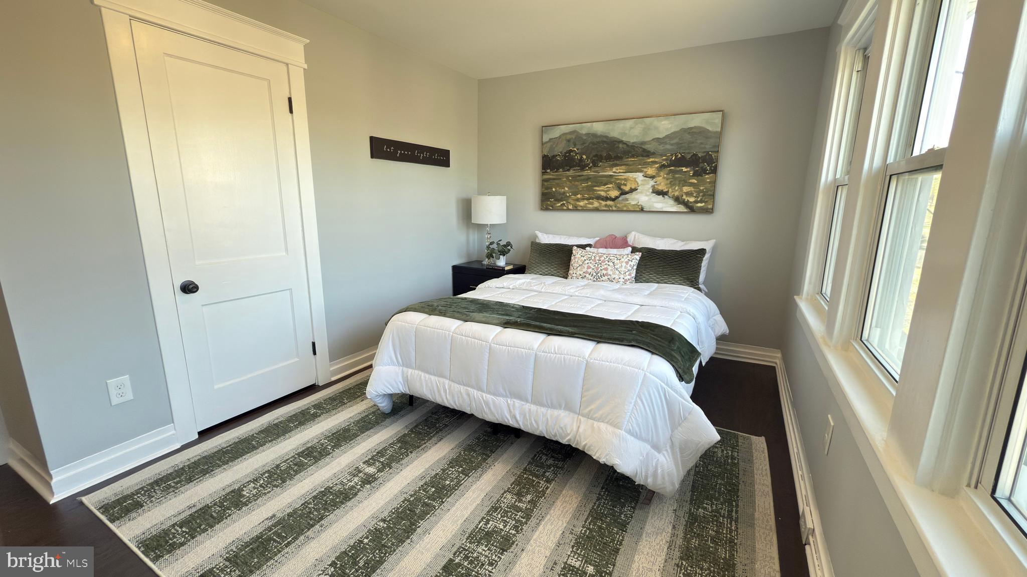 249 Hobart Avenue Hamilton, NJ 08629 - Photo 16 of 27 a bedroom with a bed and a painting on the wall
