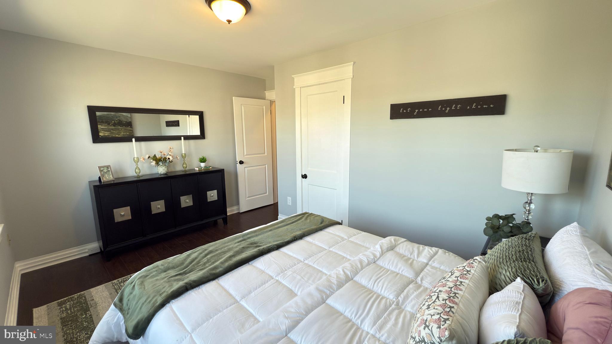 249 Hobart Avenue Hamilton, NJ 08629 - Photo 17 of 27 a bedroom with a bed and a lamp on dresser