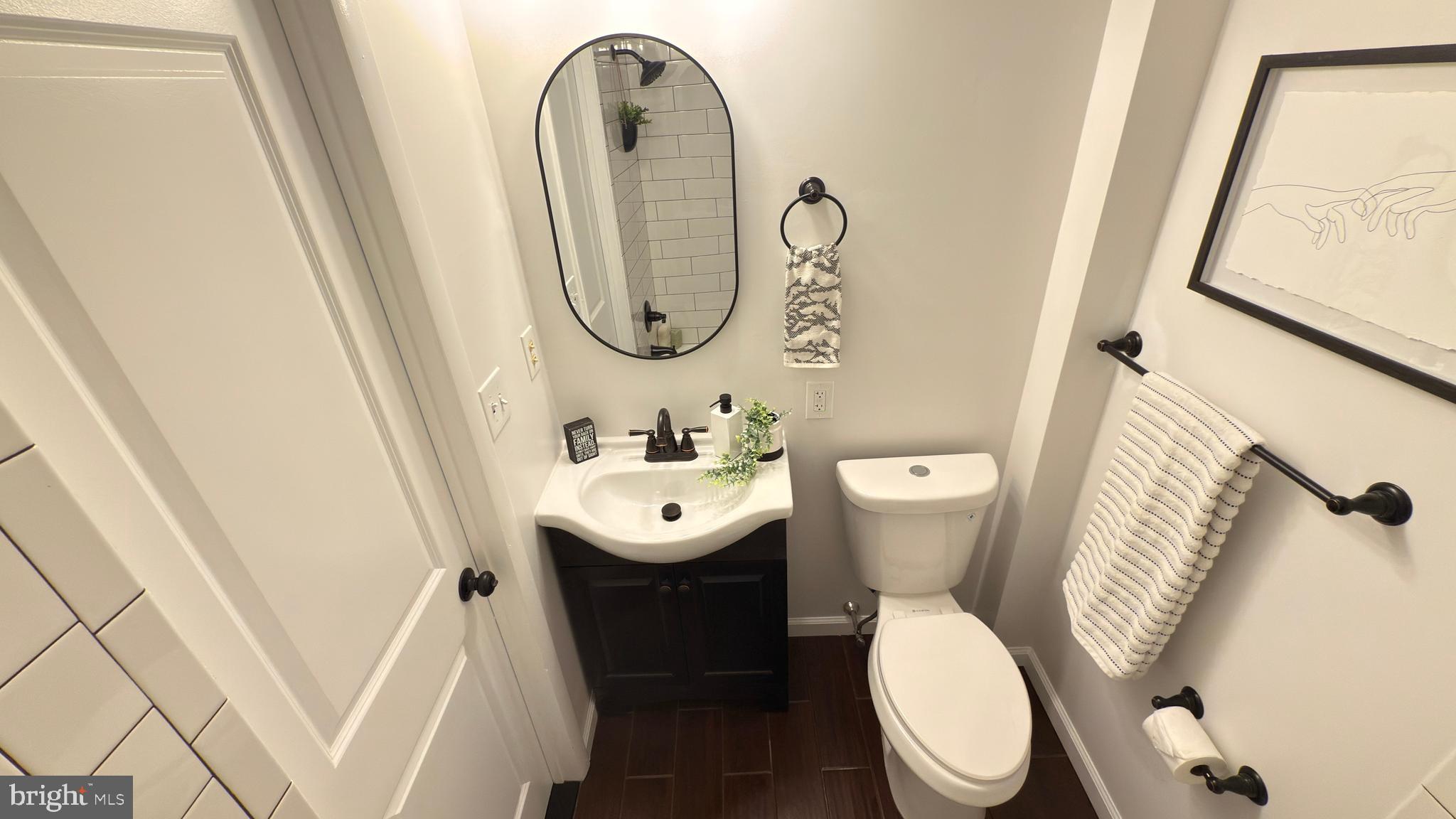 249 Hobart Avenue Hamilton, NJ 08629 - Photo 19 of 27 a white toilet sitting next to a small sink