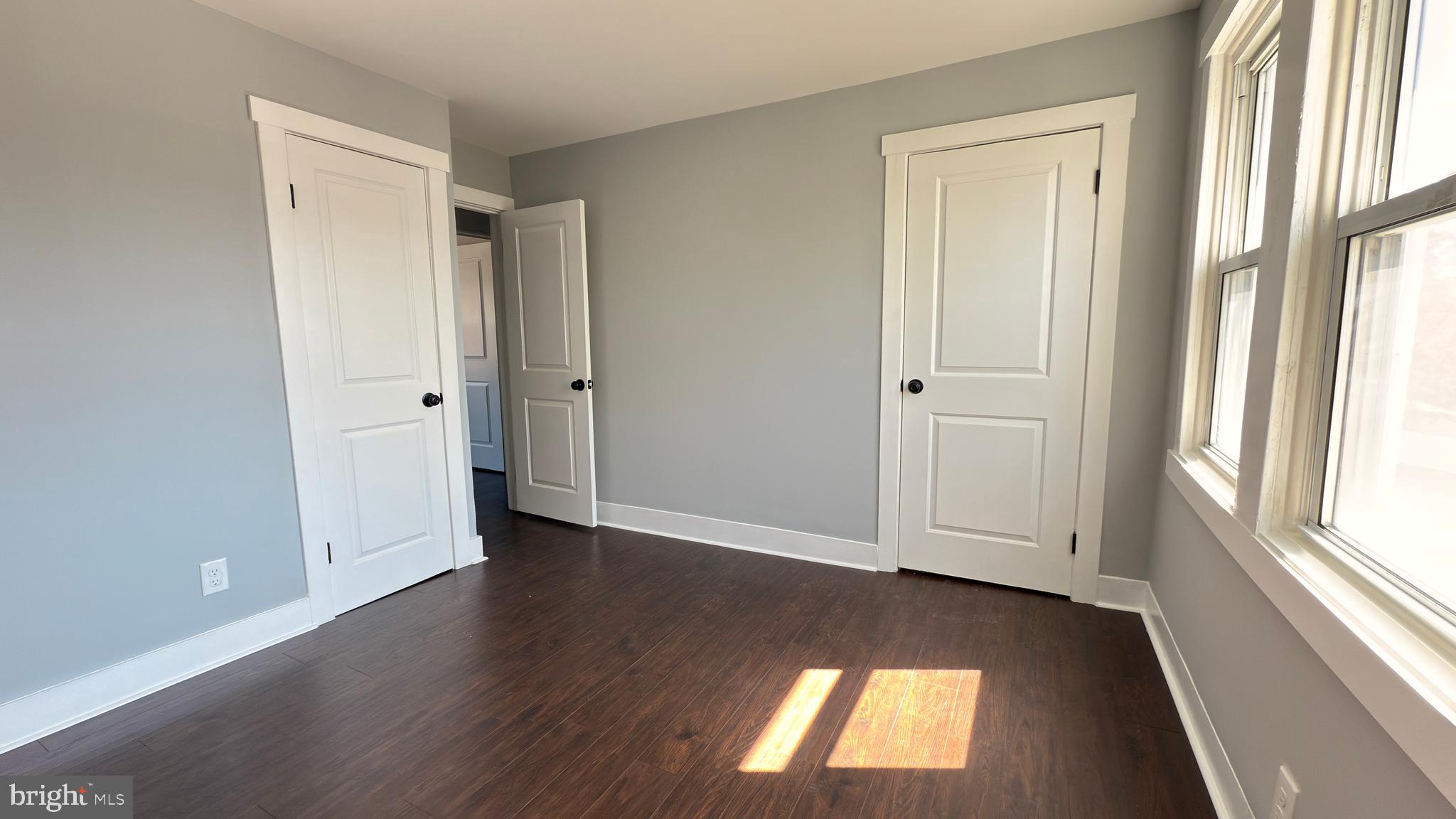 249 Hobart Avenue Hamilton, NJ 08629 - Photo 22 of 27 an empty room with wooden floor and windows