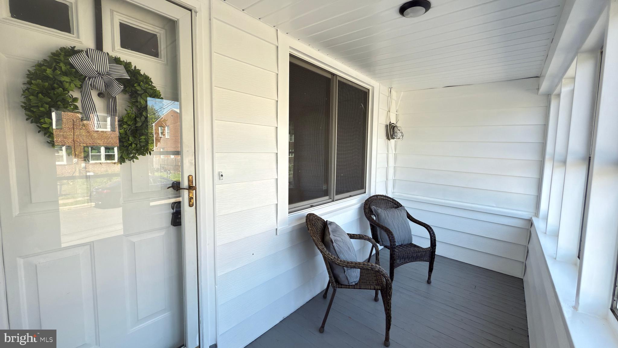249 Hobart Avenue Hamilton, NJ 08629 - Photo 26 of 27 a bathroom with a chair and a mirror
