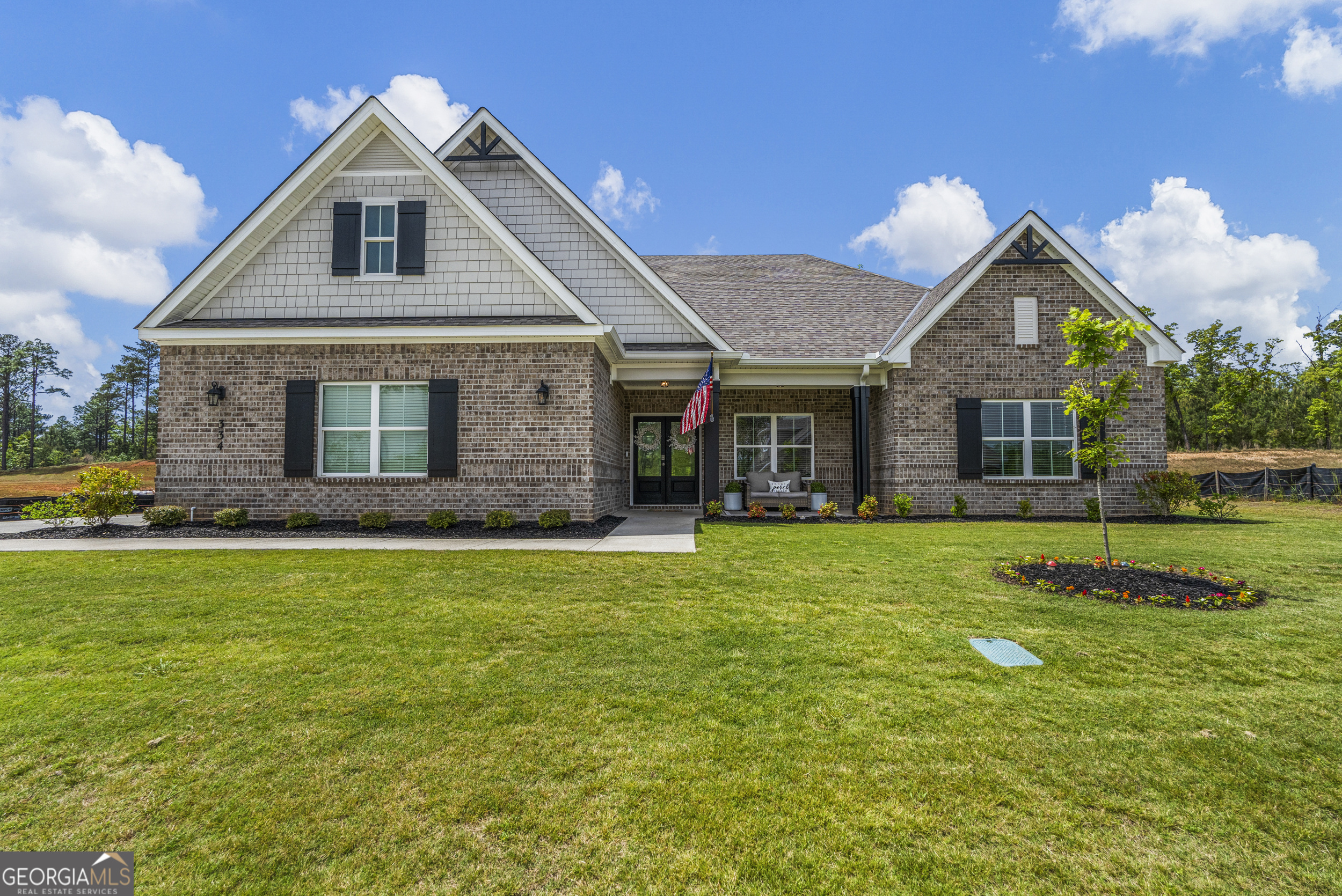 334 Orchard Drive Fortson, GA 31808 - Photo 1 of 48 a front view of a house with a garden