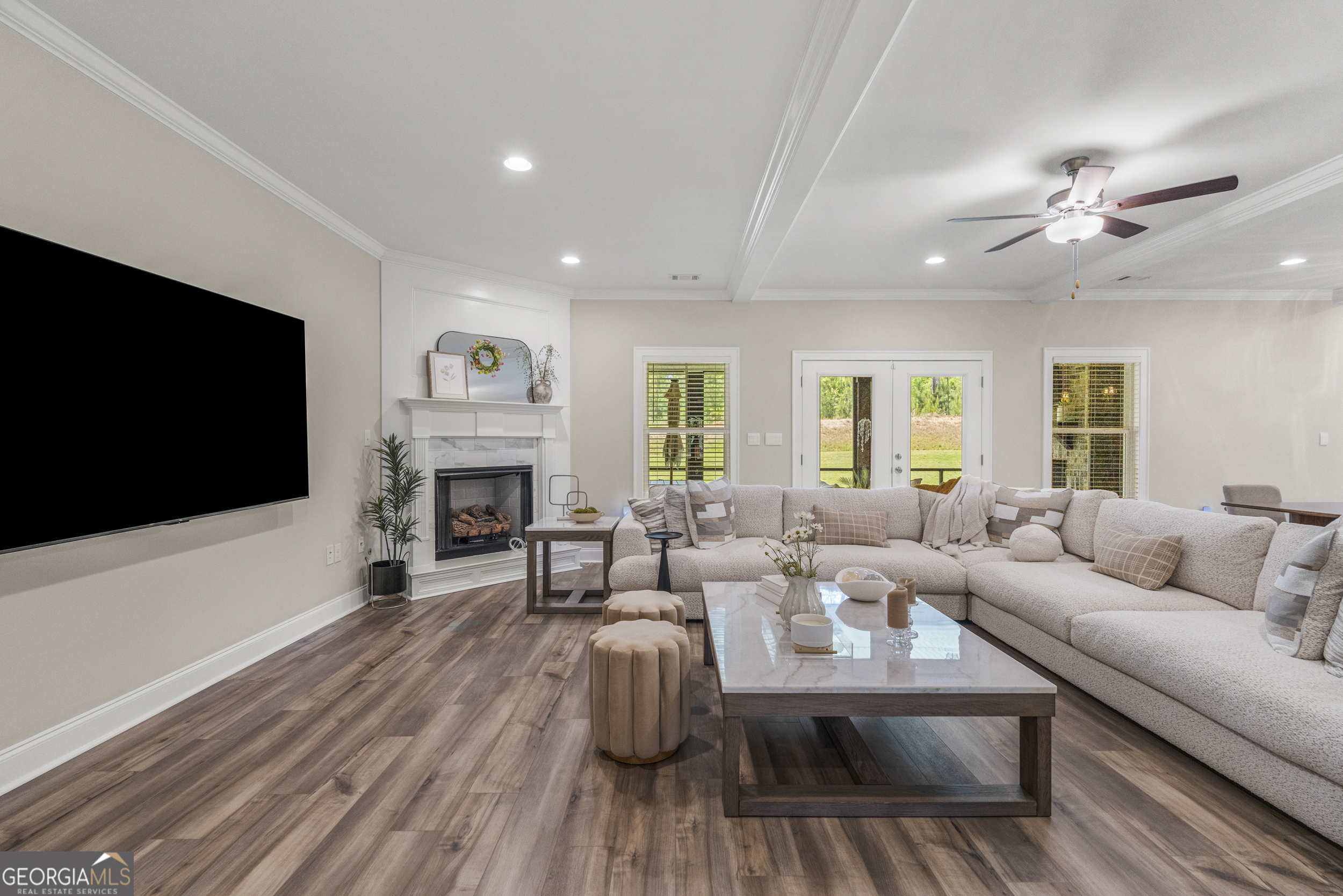 334 Orchard Drive Fortson, GA 31808 - Photo 16 of 48 a living room with furniture a flat screen tv and a fireplace